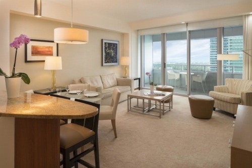 https://suiteness.imgix.net/destinations/miami/conrad-miami/suites/bay-view-2-bedroom-condo-with-2-king-beds/living-area.jpg?w=96px&h=64px&crop=edges&auto=compress,format