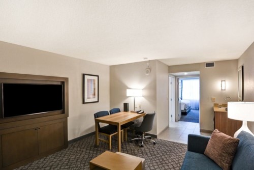 https://suiteness.imgix.net/destinations/orlando/embassy-suites-orlando-downtown/suites/2-room-suite-2-double-beds-non-smoking-2-room-suite-2-double-beds-non-smoking/living-area-2.jpg?w=96px&h=64px&crop=edges&auto=compress,format